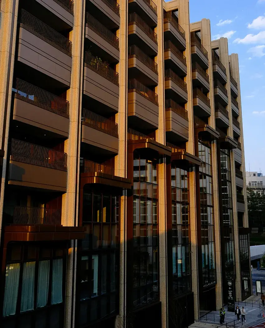People walking next to multi-family building