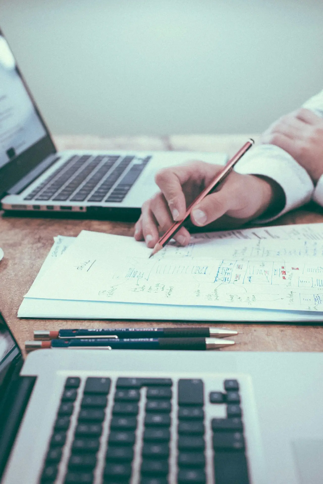 Writing plans next to computer